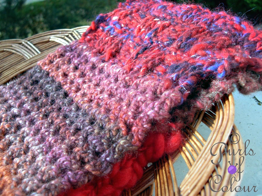 Unique long handknitted scarf in patchwork style: Reds