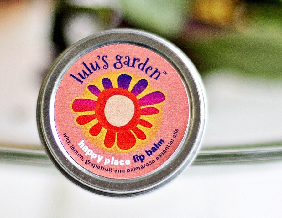 Lip Balm. Happy Place. Aromatherapy. Beeswax, Cocoa Butter, Sweet Almond Oil, Lemon, Grapefruit and Palma-Rosa Essential Oils