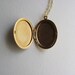 Stunning vintage 14k gold oval locket, etched engraved floral design with silver flowers, 1950s or 60s, on long delicate gold chain