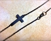 tiny dark sideways cross necklace with black chain
