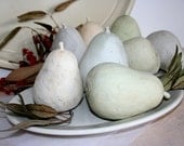 Three pale earthenware pears