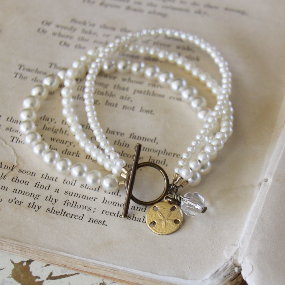 repurposed pearls, vintage crystal and  sand dollar charm bracelet // 3 strands of pearls // copalis bracelet