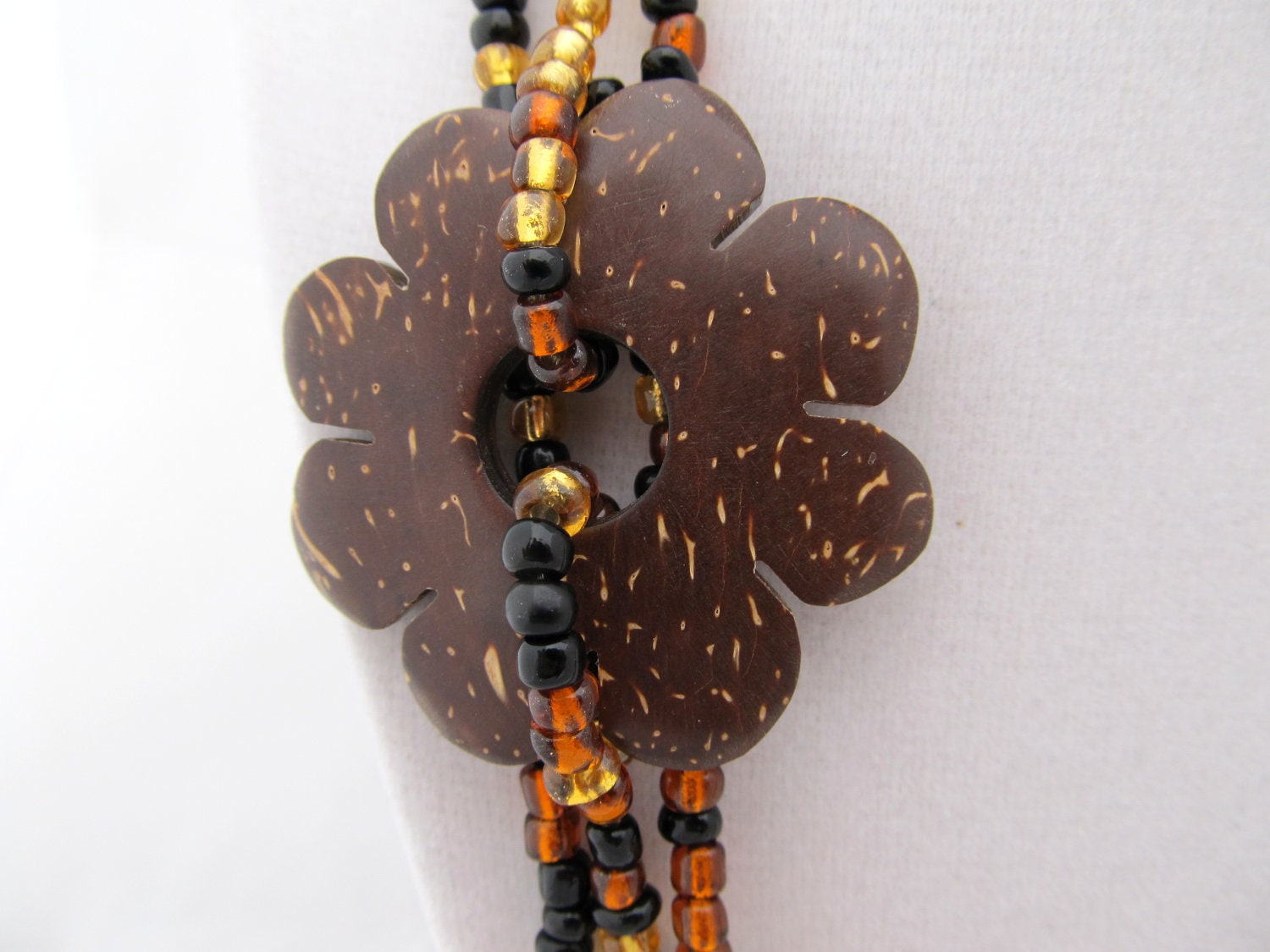 Asymmetrical coconut flower necklace and earring set