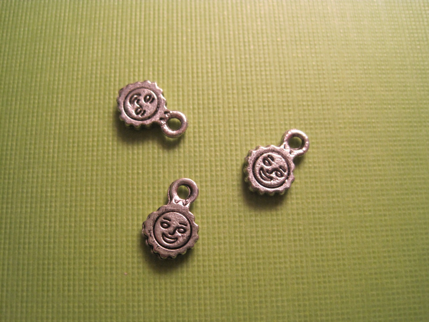 Set of 30 antique silver double sided sun happy face charms