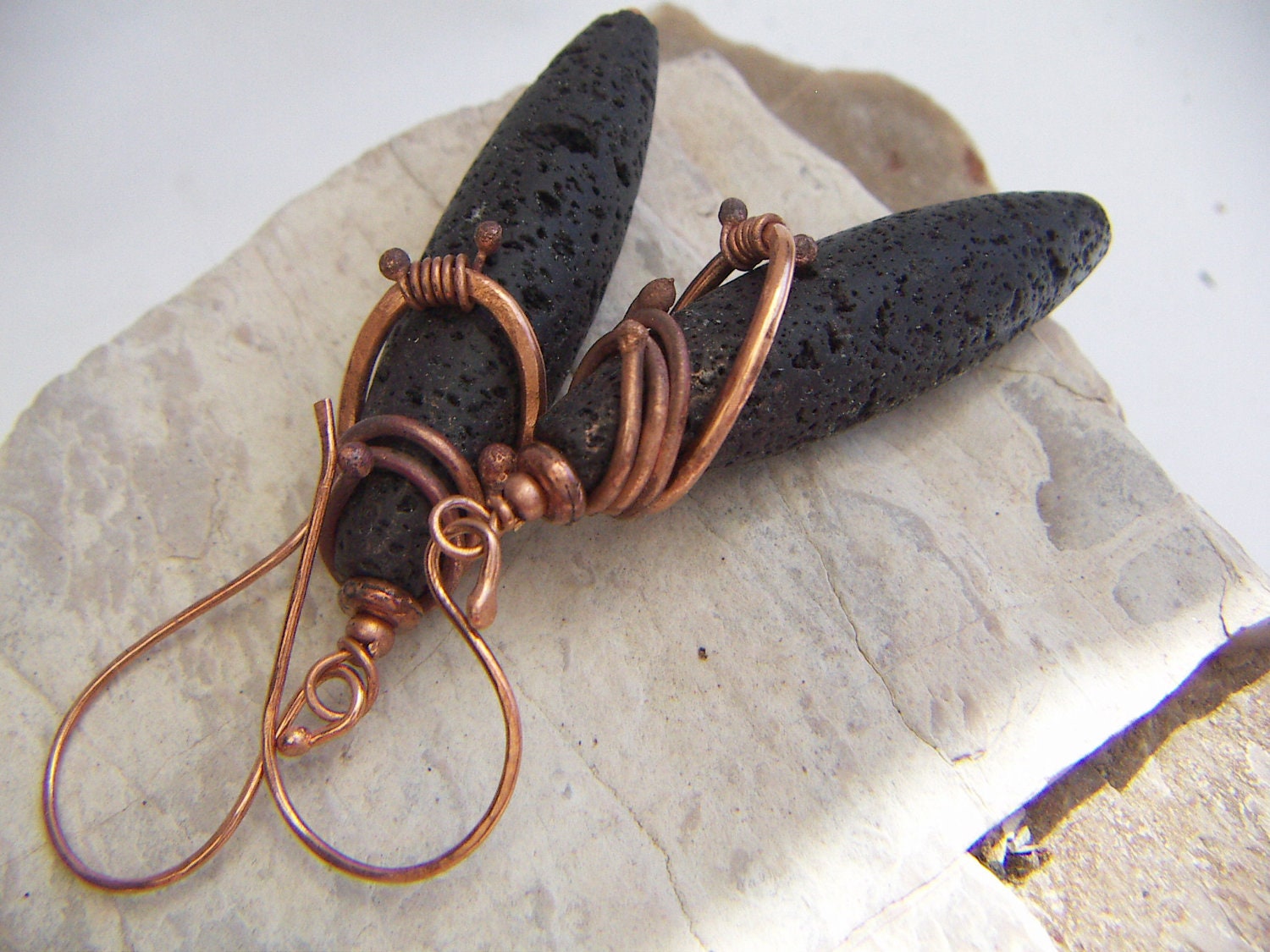 Long Oval Lava Earrings With a Copper Wrap
