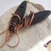 Long Oval Lava Earrings With a Copper Wrap