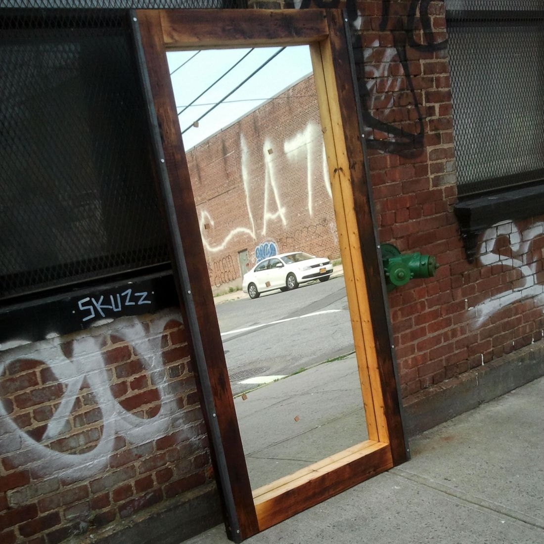 Salvaged floor joist monster mirror