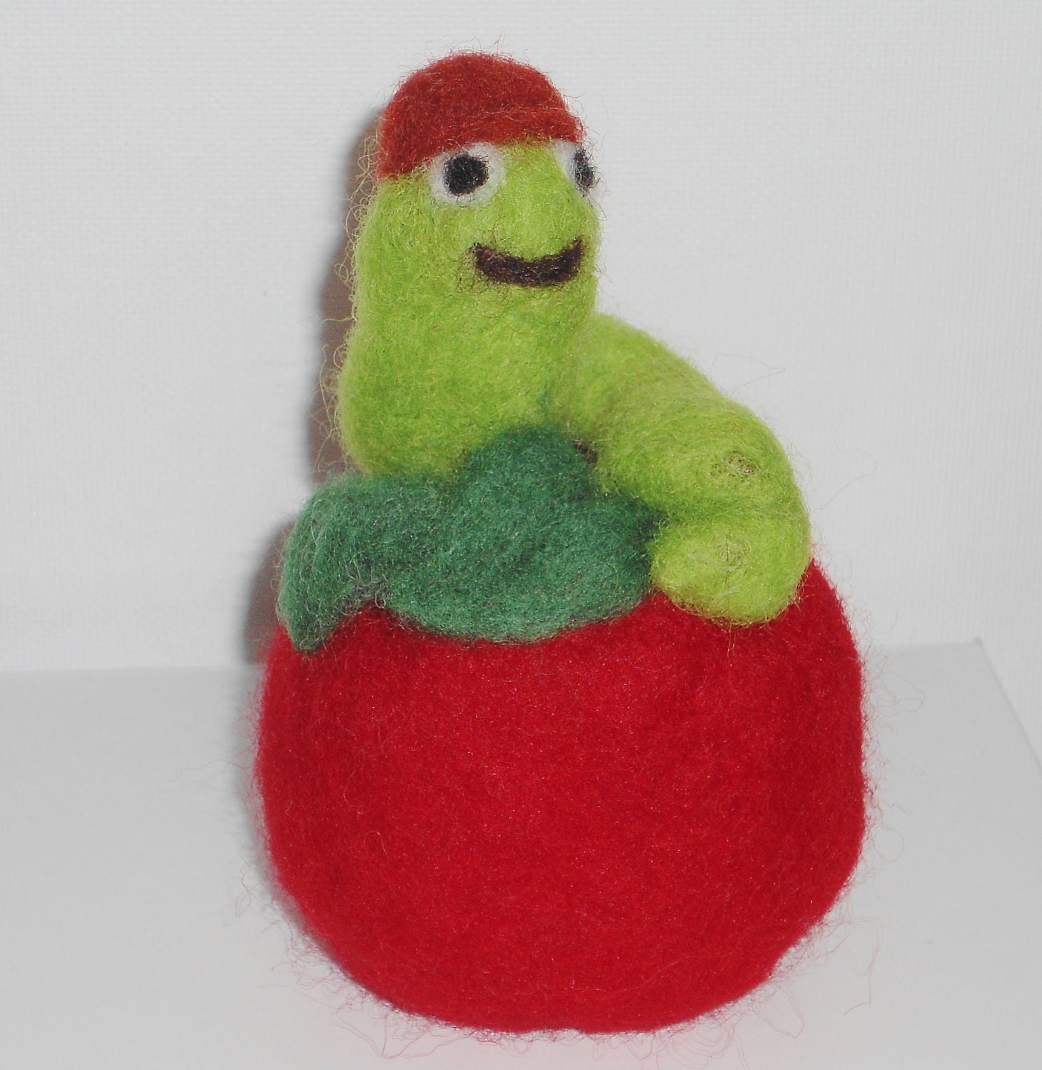 Apple needle felted red with green worm