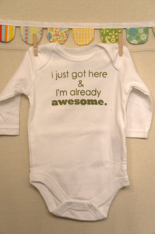 I just got here & I'm already awesome.  --- white long-sleeved onesie, size 0-3 months.