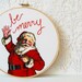 Christmas Decor. Embroidery Hoop Fabric Wall Hanging in Hoop. Classic Santa "be merry" Embroidered Text. Handmade by Merriweather Council