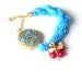 Turquoise silk bracelet with pink jade ,pearl and gold plated metal