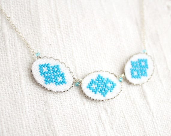 Hand embroidered necklace with three blue Ukrainian ornament in silvertone