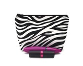 Zebra print cosmetic bag. Makeup storage. Womens accessory. Purple lining.