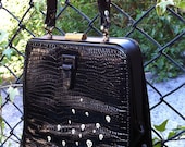 Tiny Skulls: Upcycled hand painted vinyl purse.