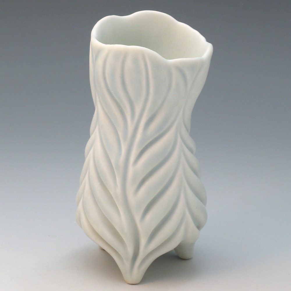 Curvy hand carved pale blue porcelain vase