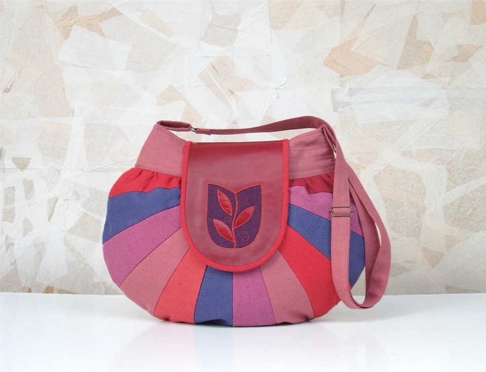 Round as the world unique handmade bag with tulip window motif in red purple and mauve colors