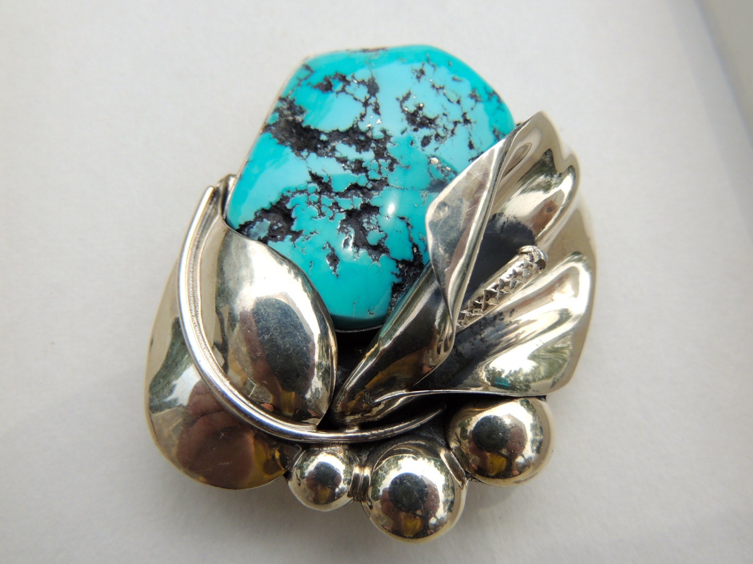 Turquoise and sterling silver native american floral design brooch       VJSE