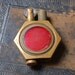 Vintage brass lighter with red enamel