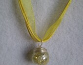 Fried glass crackled  Marble with yellow swirl on  a yellow ribbon necklace