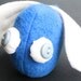 beady-eyed flying blue scrap monster