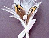 Men's wedding boutonniere with white and brown striped feathers