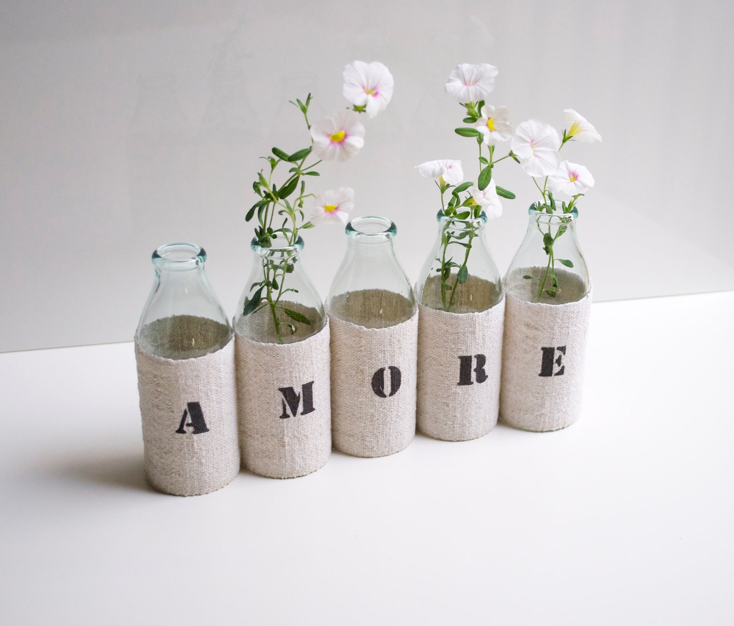 AMORE vase -  from 5 small recycled glass bottles and a grain sack cover