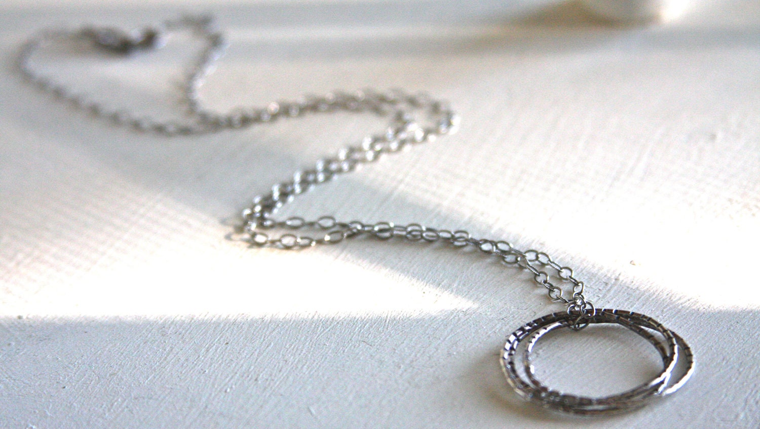 Long oxidized sterling silver necklace with 3 large interlocking oxidized sterling silver rings. - HollyMackDesigns