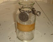 handblown glass apothecary jar with original label upcycled with wire and aluminum numerical tag