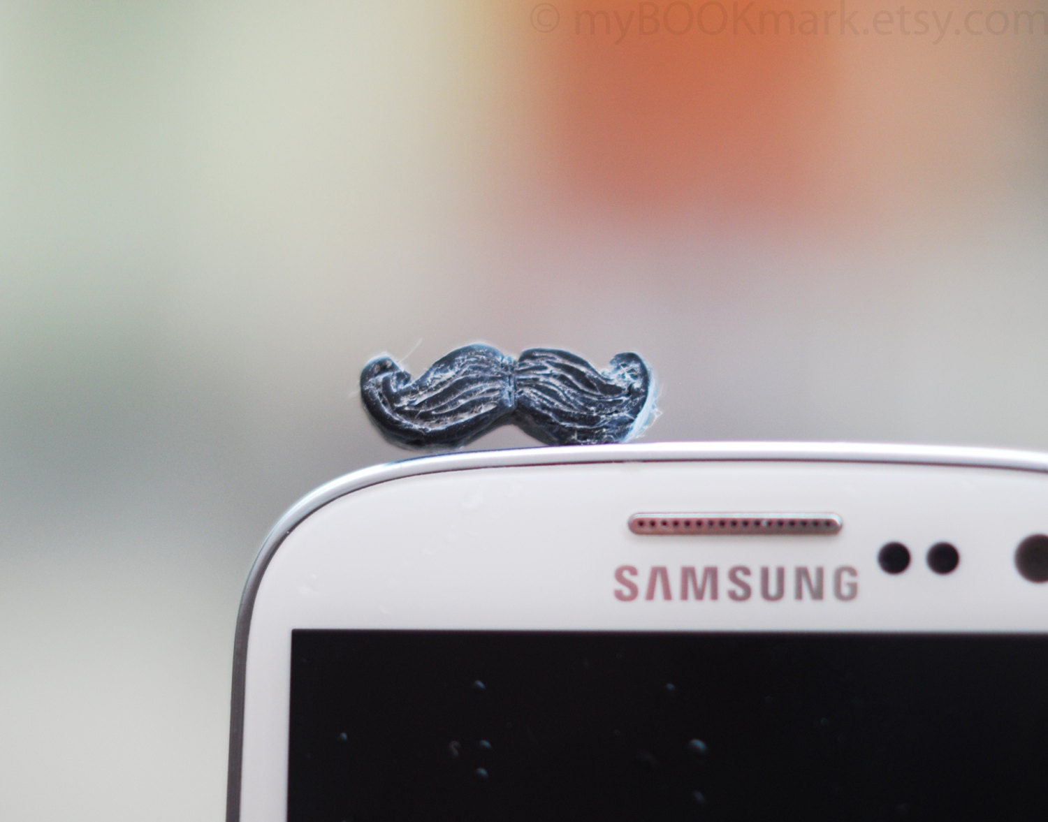 Mustache phone accessory. Movember plug for earphone jack. Fits iPhone 5 4 4s ,iPad ,Samsung galaxy s2 s3, 3.5mm output. Ohtteam for all
