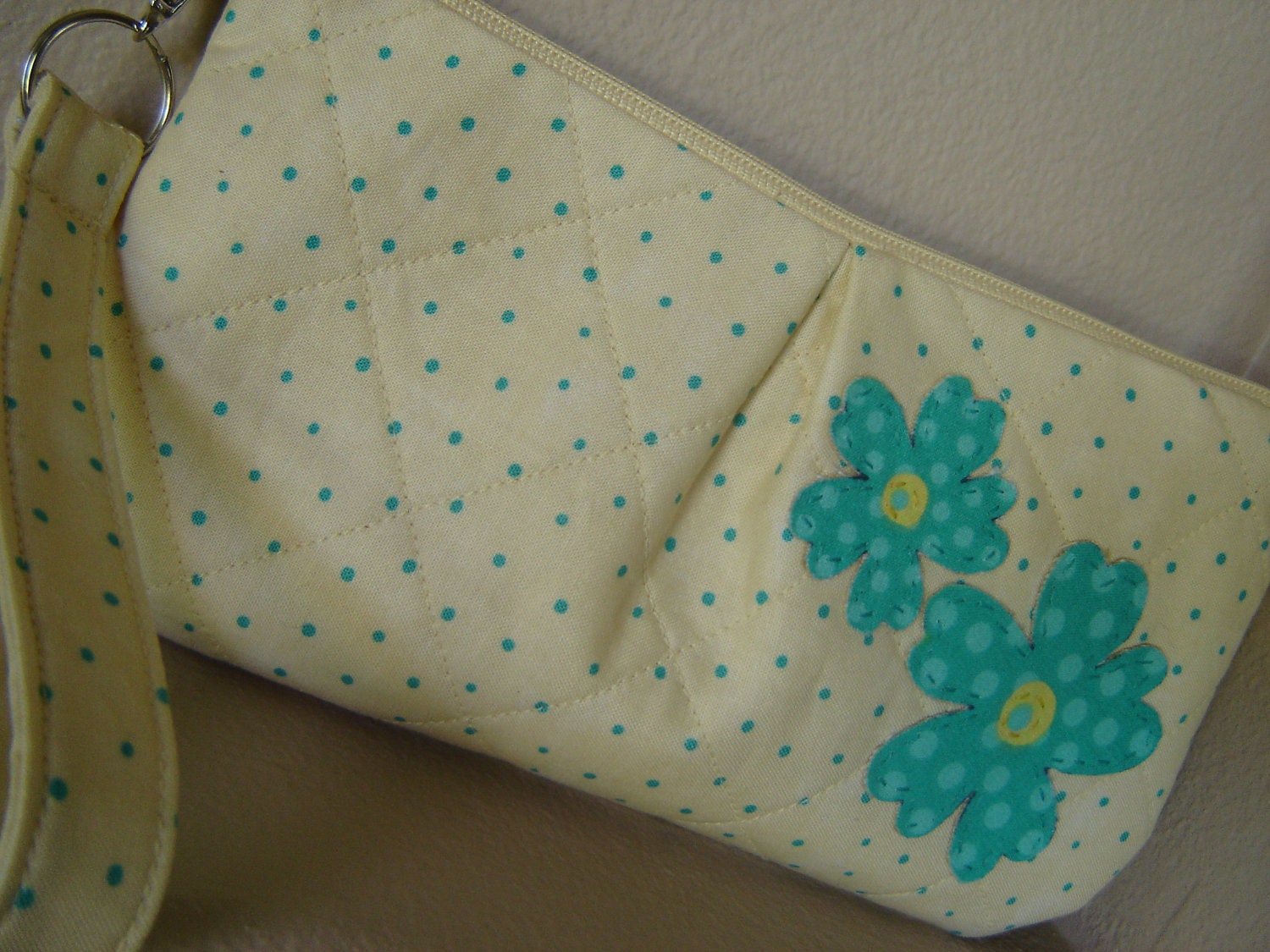 Quilted clutch wristlet pale yellow turquoise polka dot with two turquoise applique flowers