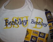 Purple and gold bib, burp cloth, and pacifier clip gift set