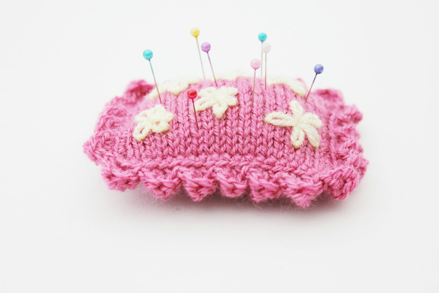 Pink knitted pincushion