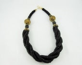 reduced. ETHNIC vtg 1980s. black beads and brass necklace. BOHO.