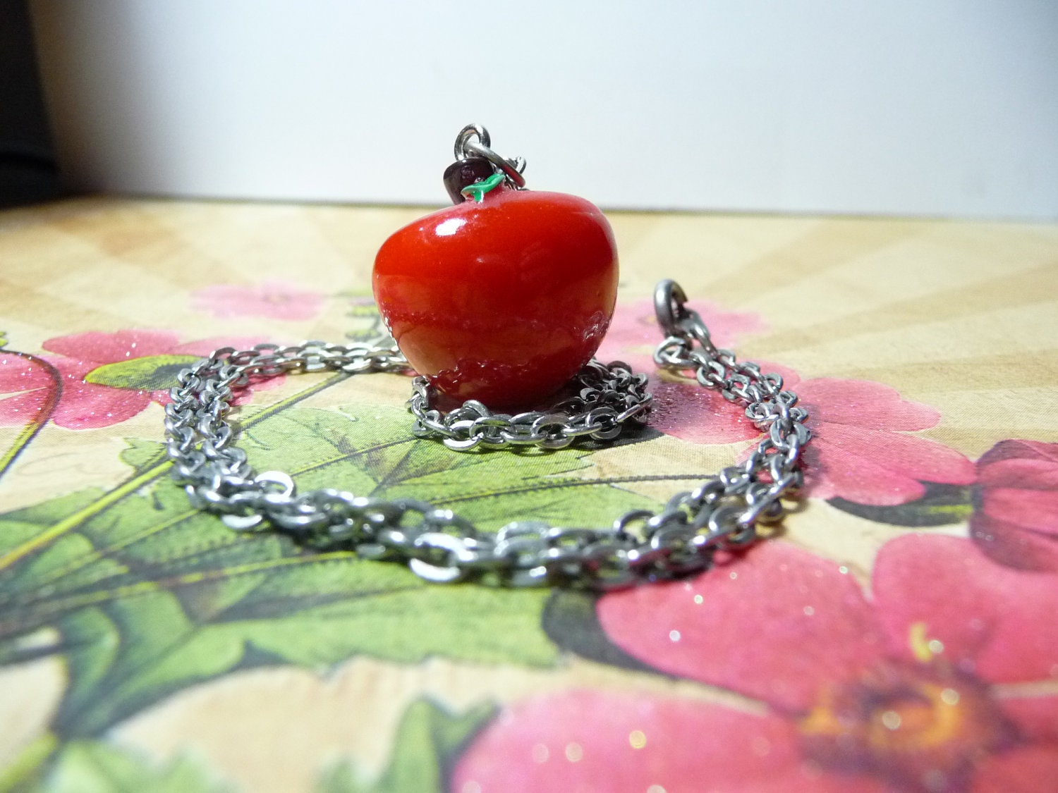 Snow White's Bitten Apple necklace by vintagerust