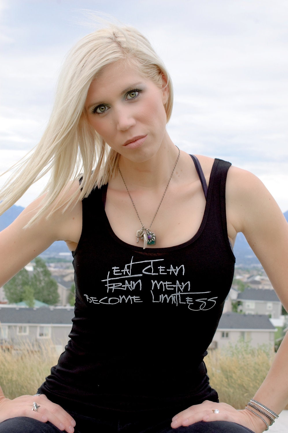Eat Clean, Train Mean, Become Limitless done in vintage looking silk screen on a black workout tank top with a plain back