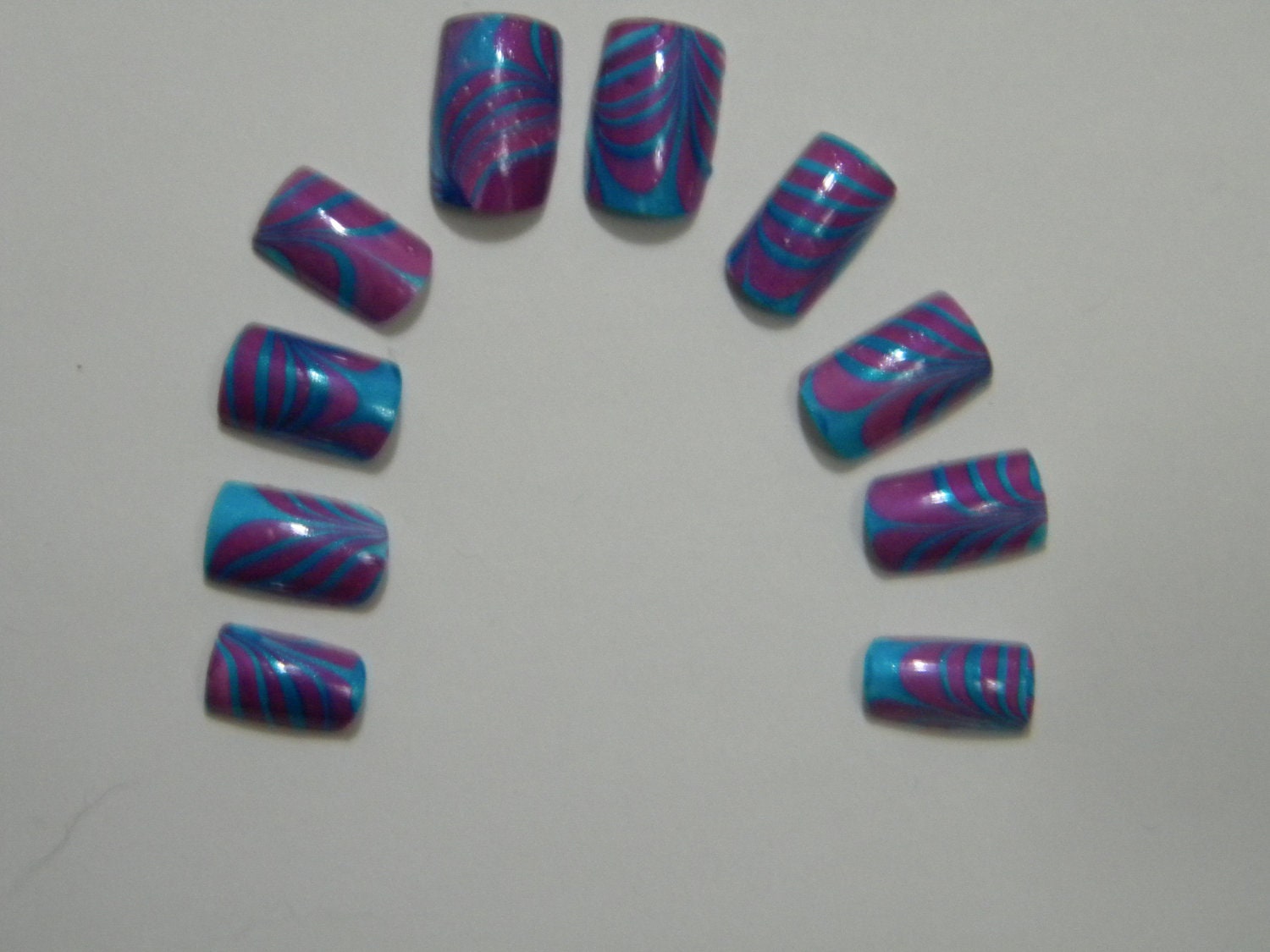 Bright Blue and Purple Water Marble Nails