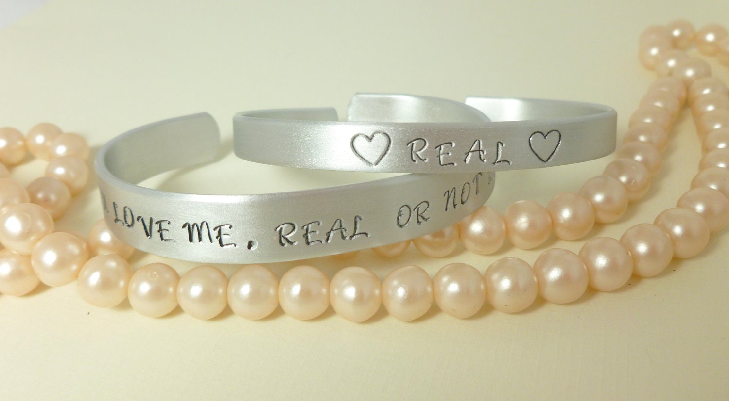 2 Hunger Games Jewelry Accessories - Hand stamped Real or not real, real