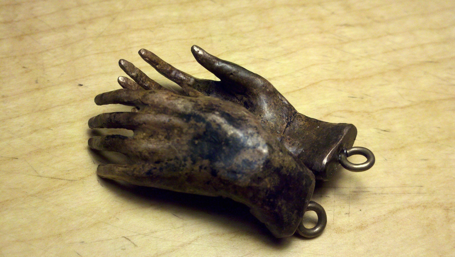 2" long small bronze hands with bronze screw eyes,