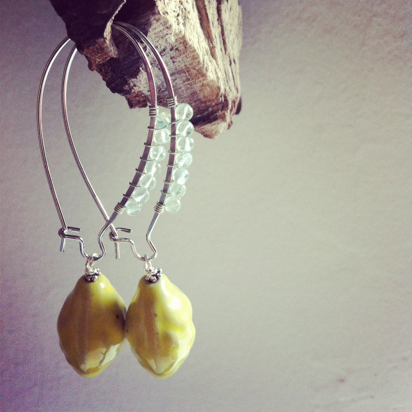 wire wrapped with aquamarine with yellow ceramic bead