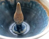Hand thrown small ornamental bowl with blues and browns