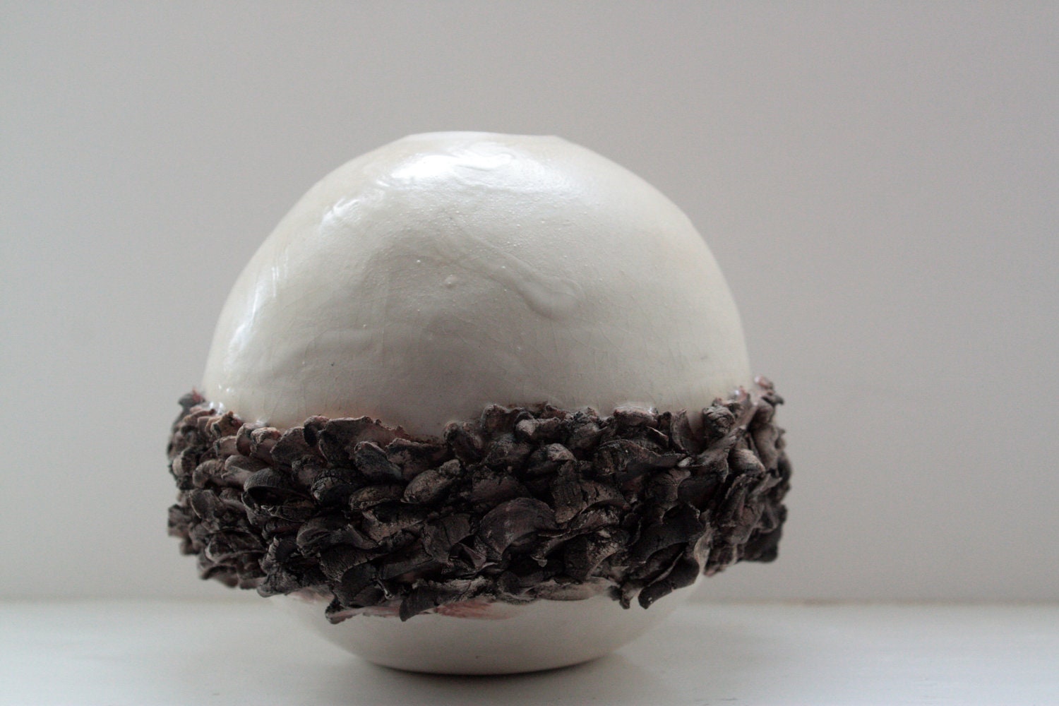 Ceramic sphere vase with white stoneware and red sanded clay.