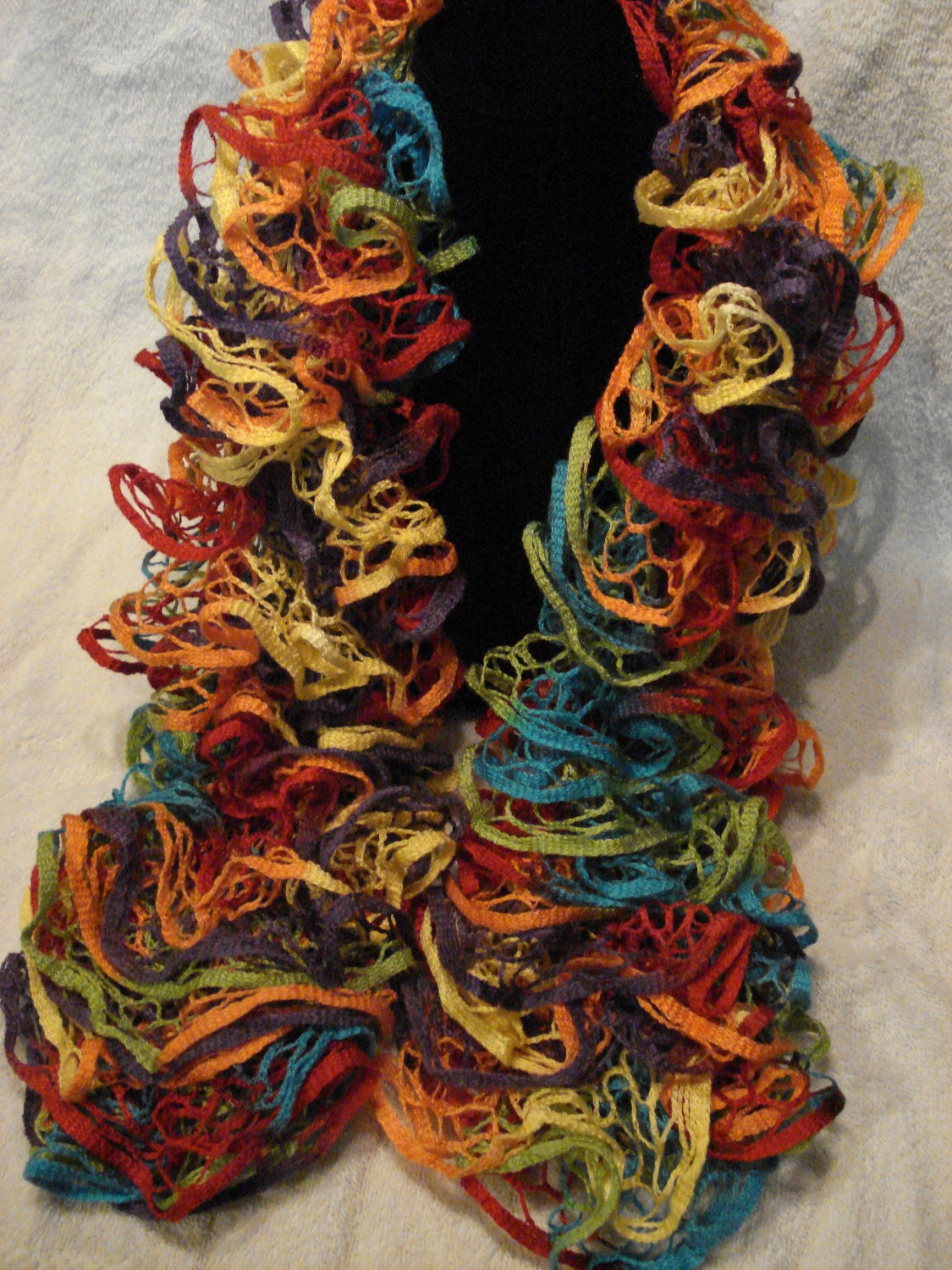 Colorful, soft hand knit ruffle scarf