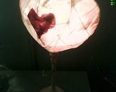 A shabby chic heart table lamp, in pink and white colours for kids bedroom and decoration