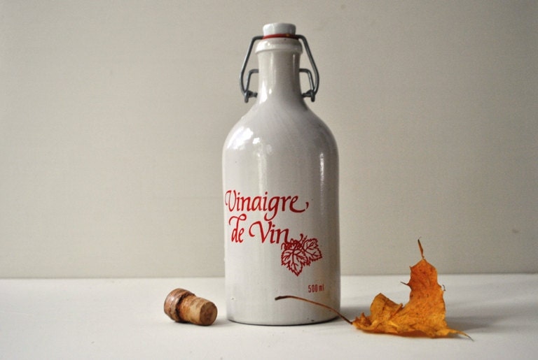 Vintage French Stoneware Covinor Red Wine Vinegar Bottle in white and Red colors with its a porcelain stopper