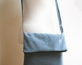 Whirl Blue. Big fold-top zipper messenger with adjustable strap. Synthetic suede. Upcycled.