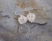 Silver nest earrings: A cute pair of earrings made from sterling silver wire with sterling silver eggs