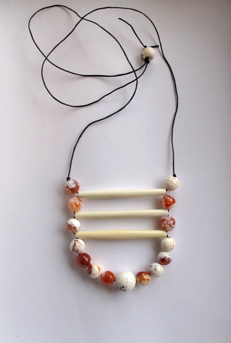Tribal beaded necklace with faceted amber colored agates bone beads on black leather cord geometric Fall fashion