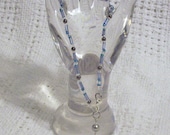 Sea Shell by the Seashore Beaded Anklet (A7007) with gunmetal and blue glass beads, and silvery clam shell charm