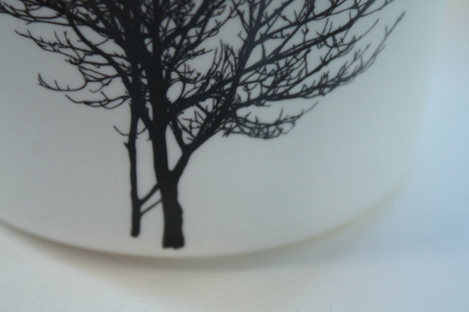 English fine white bone china vessel or tea light holder in stoneware with a black tree silhouette.