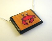 Crab on Faux Wood Background Necklace